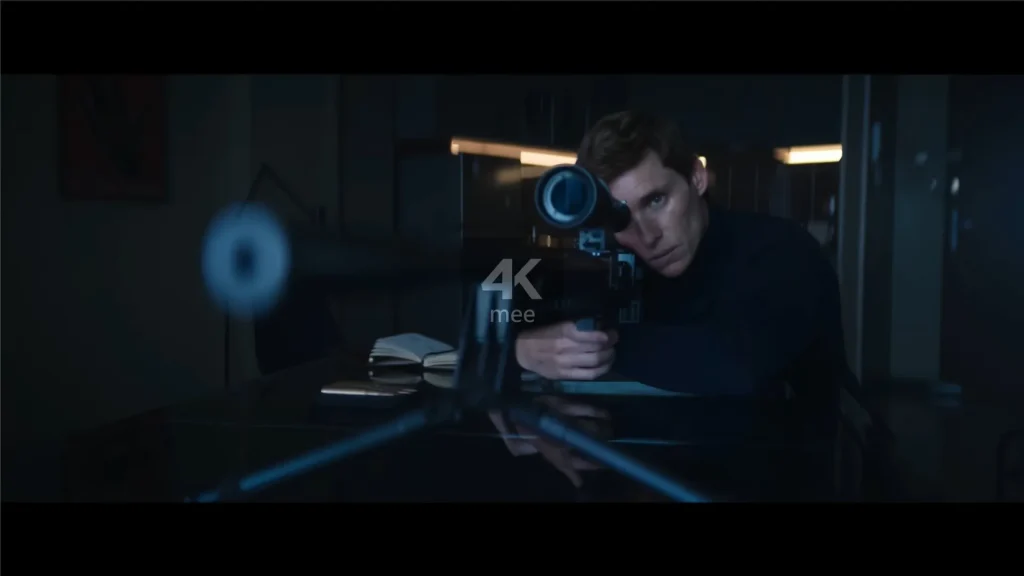 A man in a black coat aims a sniper rifle, poised to shoot.